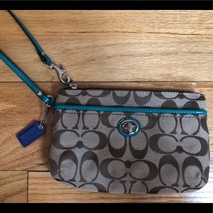 Brown and teal never used Coach wristlet!